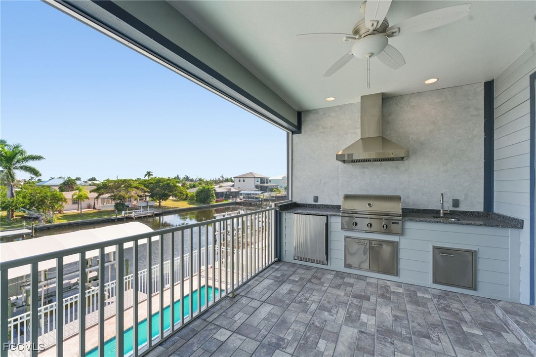 12304 Boat Shell Drive Matlacha Isles, FL 33991 - Photo 35 of 49 a kitchen with stainless steel appliances granite countertop a stove and a sink
