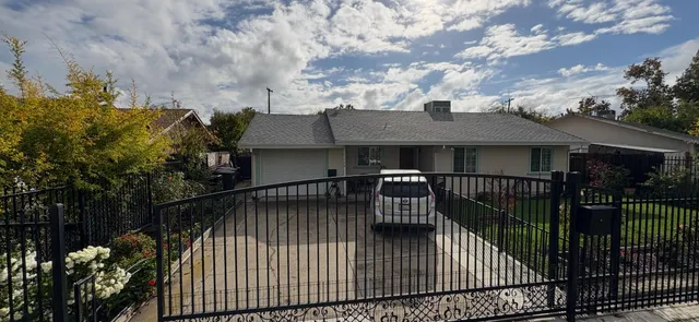 a view of a house with a wooden deck