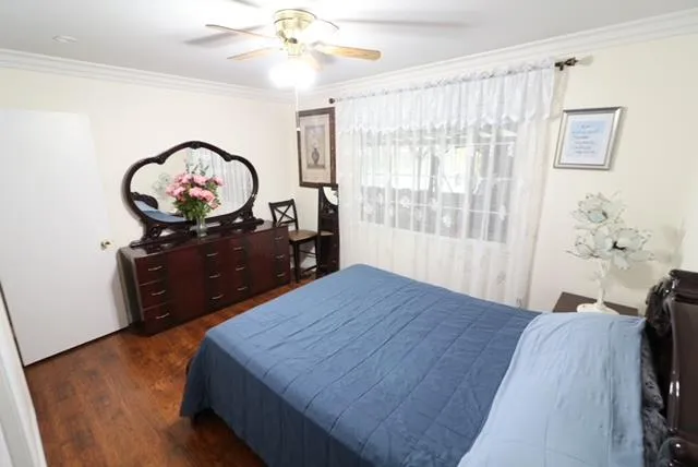 a bedroom with a bed and a lamp