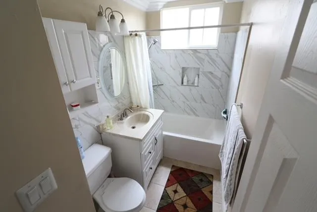 a bedroom with a bed window and chair