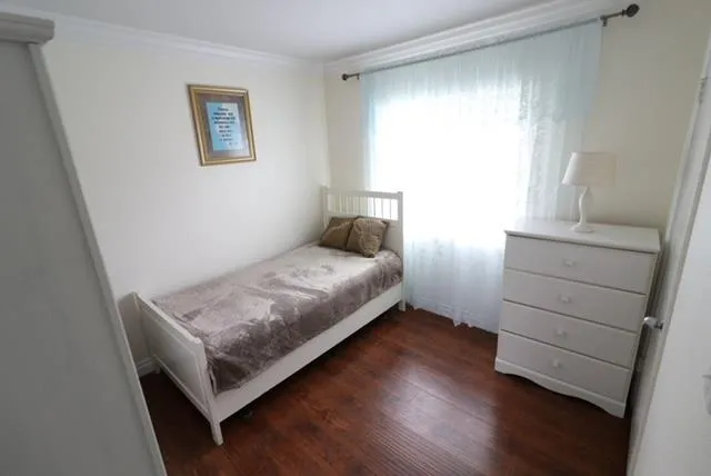 a living room with a couch and a large window