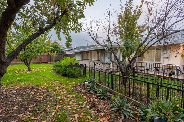 a backyard of a house with lots of green space