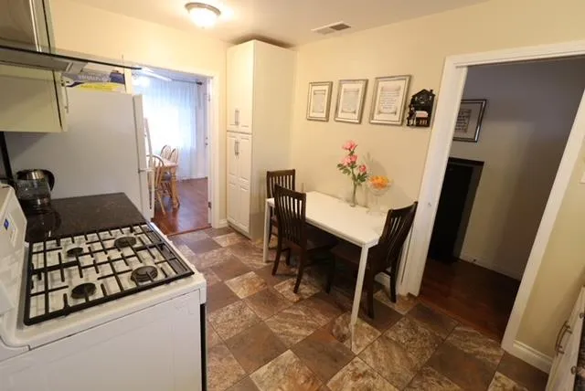 a bedroom with a bed and a potted plant