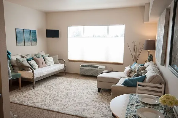 a living room with furniture and a couch