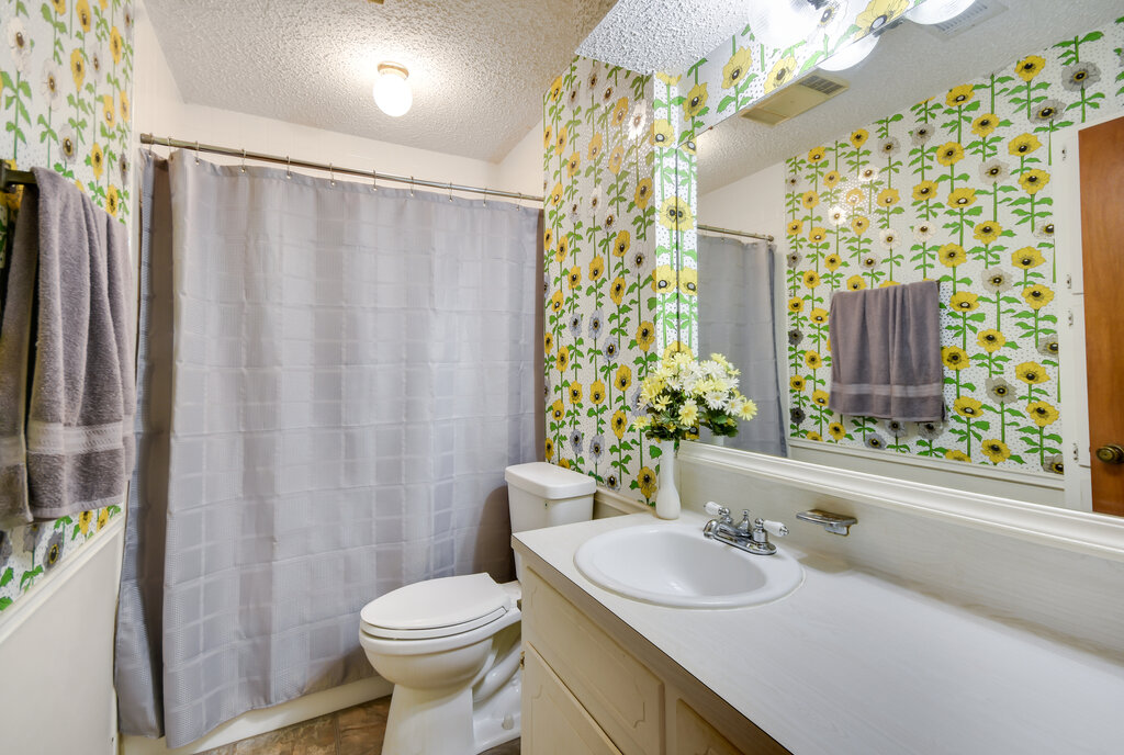 301 Navajo Trail Georgetown, TX 78633 - Photo 34 of 35 Full bathroom with a textured ceiling, vanity and toilet.
