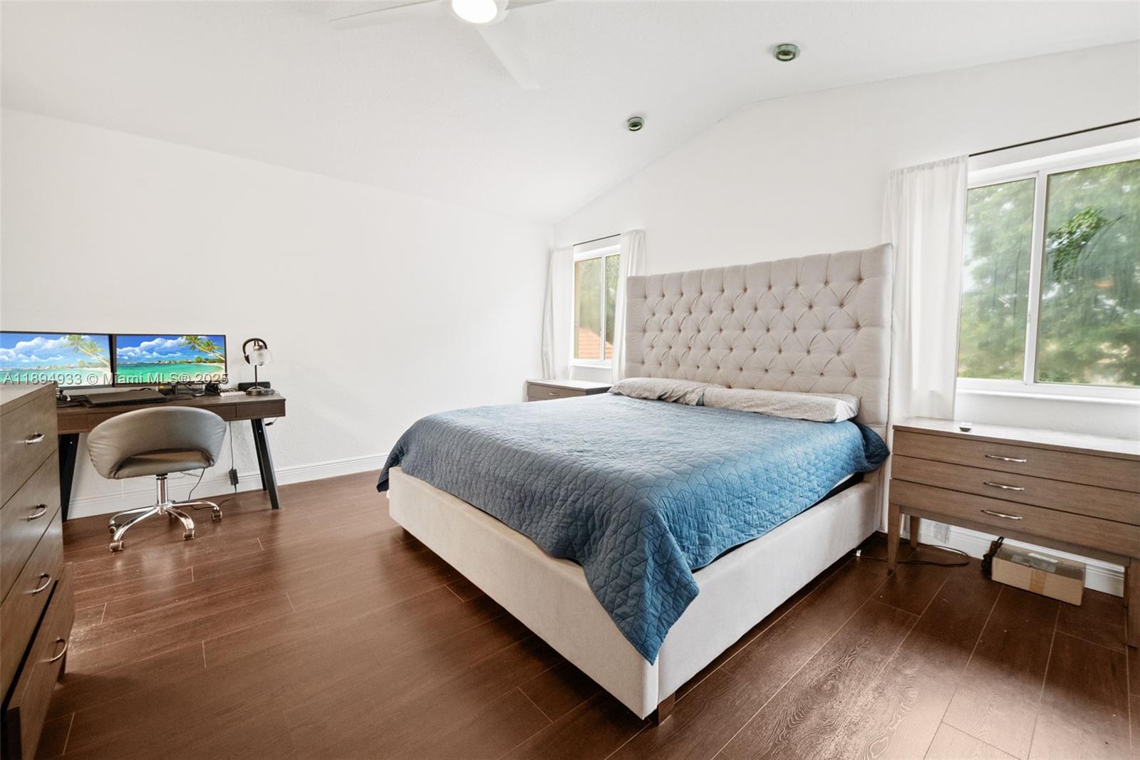 1611 Southwest 158th Avenue Pembroke Pines, FL 33027 - Photo 14 of 25 a bedroom with a bed chair and a large window