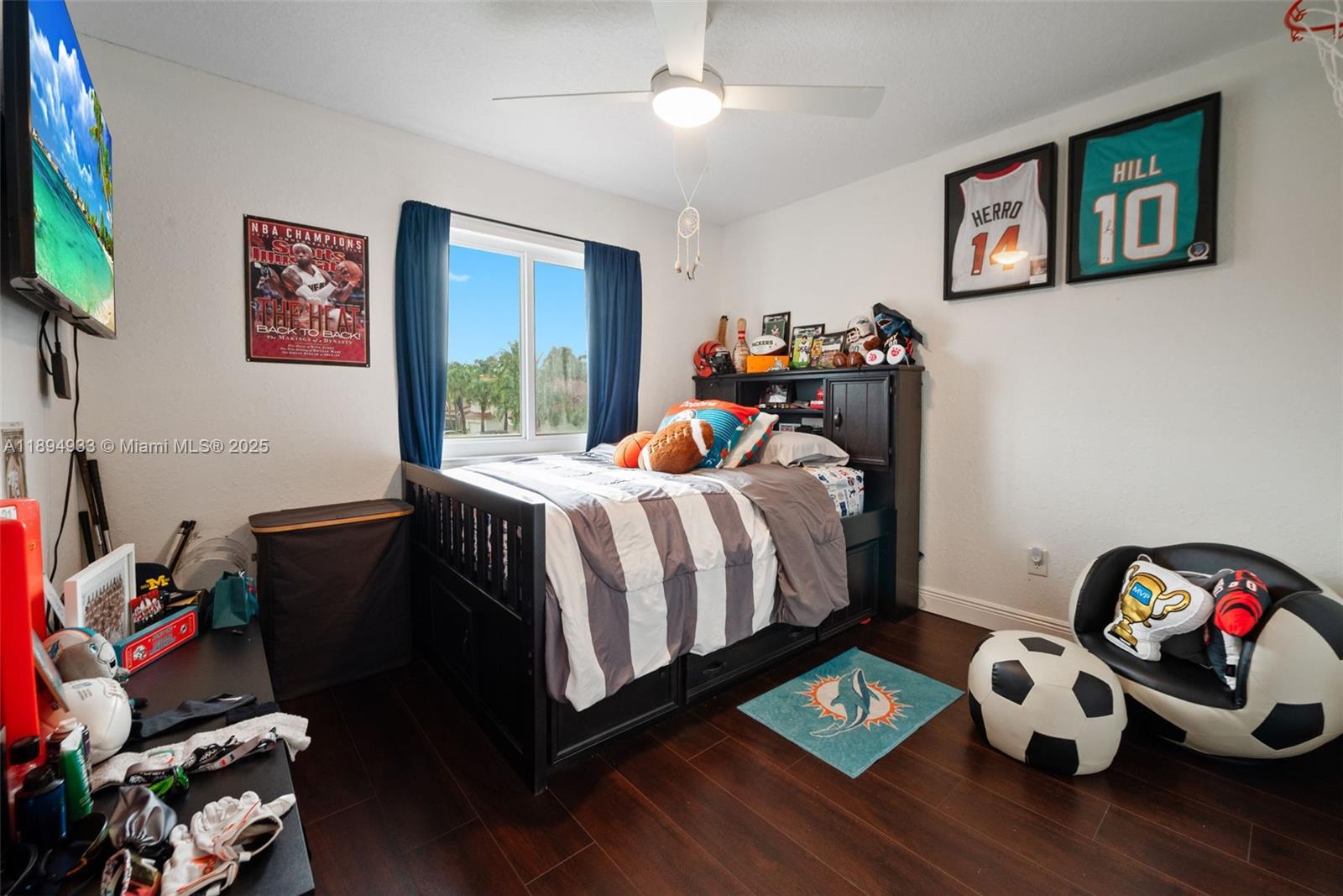 1611 Southwest 158th Avenue Pembroke Pines, FL 33027 - Photo 18 of 25 a bedroom with bed and a chandelier