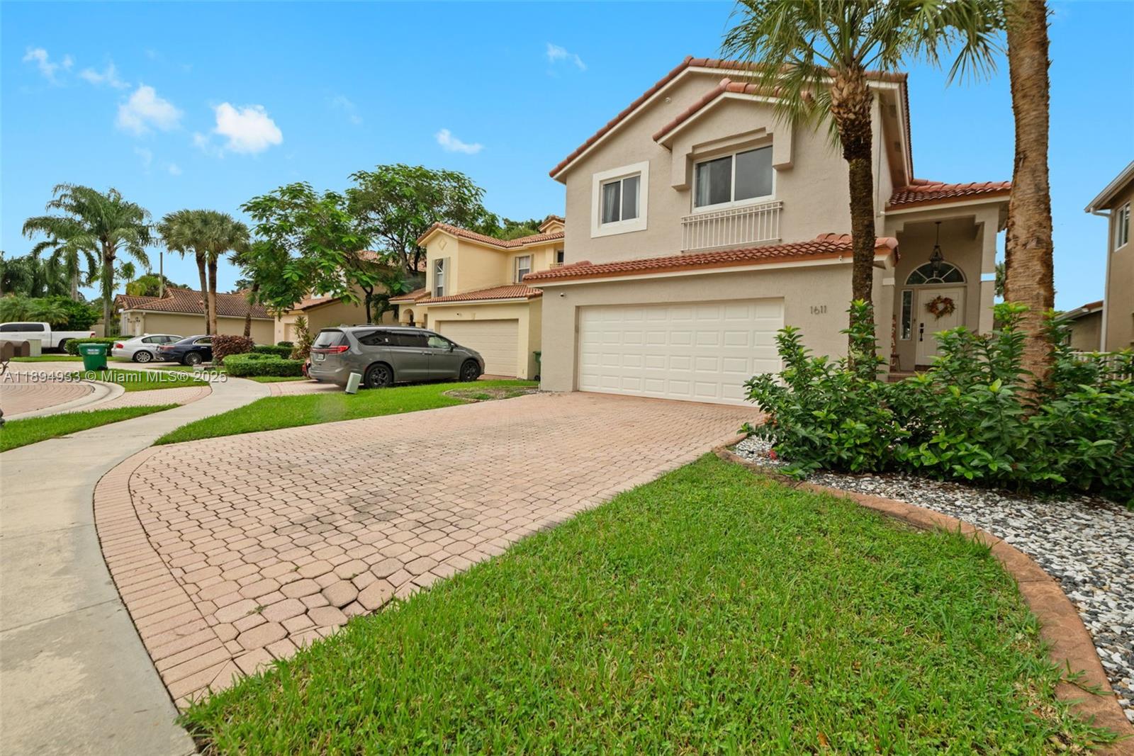 1611 Southwest 158th Avenue Pembroke Pines, FL 33027 - Photo 2 of 25 a view of a house with a yard and potted plants