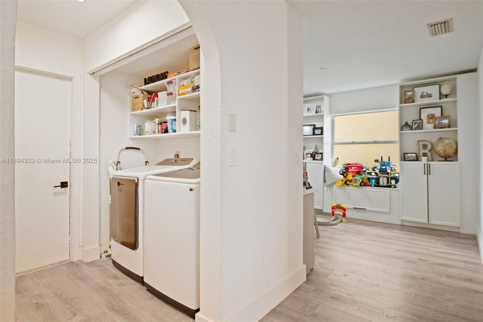 1611 Southwest 158th Avenue Pembroke Pines, FL 33027 - Photo 21 of 25 a view of utility room with closet and mirror