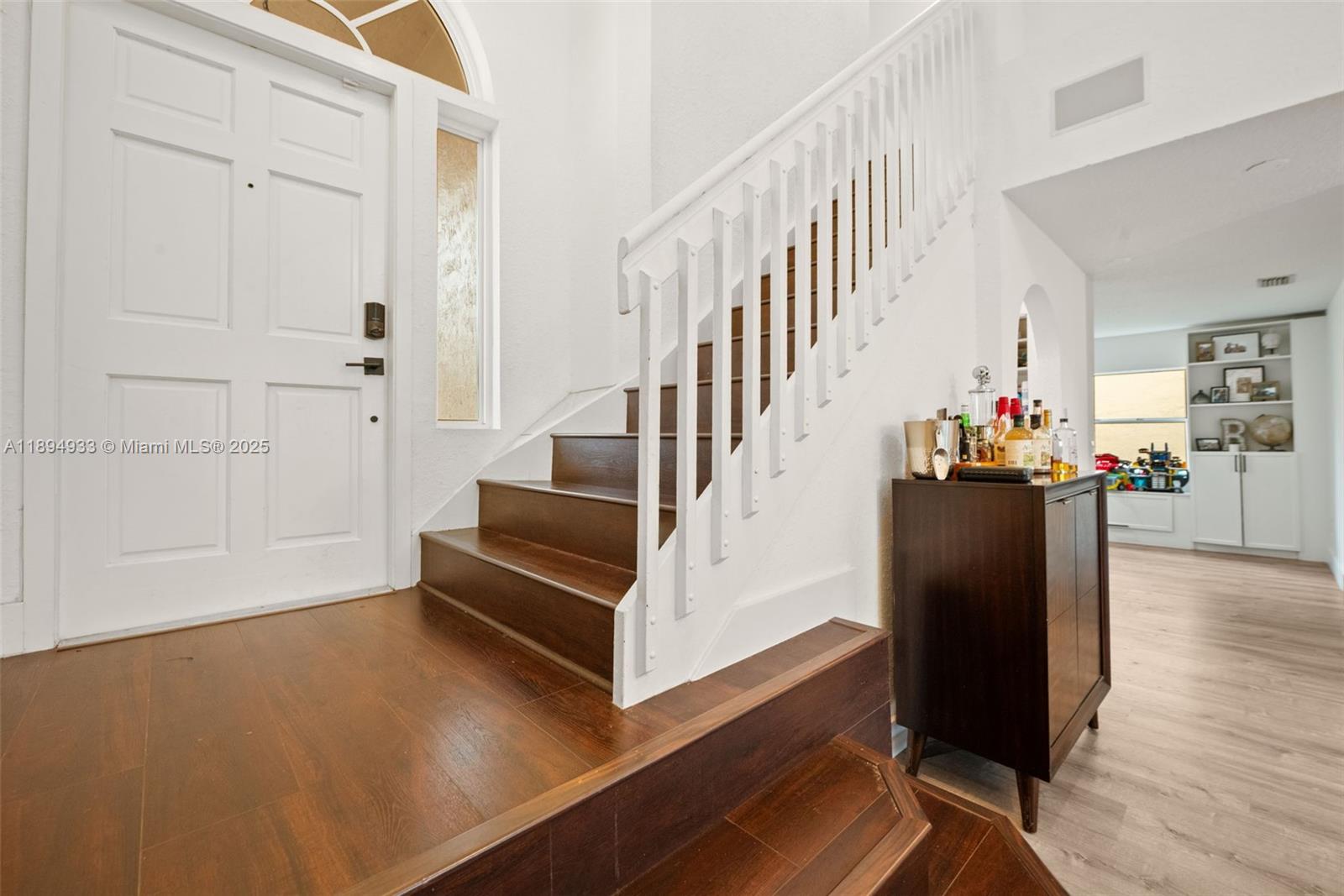 1611 Southwest 158th Avenue Pembroke Pines, FL 33027 - Photo 3 of 25 a view of entryway and hall with wooden floor