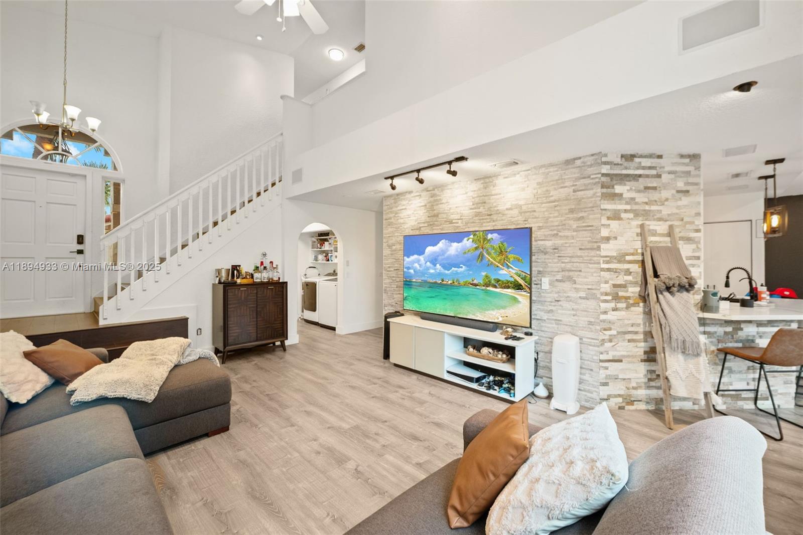 1611 Southwest 158th Avenue Pembroke Pines, FL 33027 - Photo 4 of 25 a living room with furniture and a flat screen tv