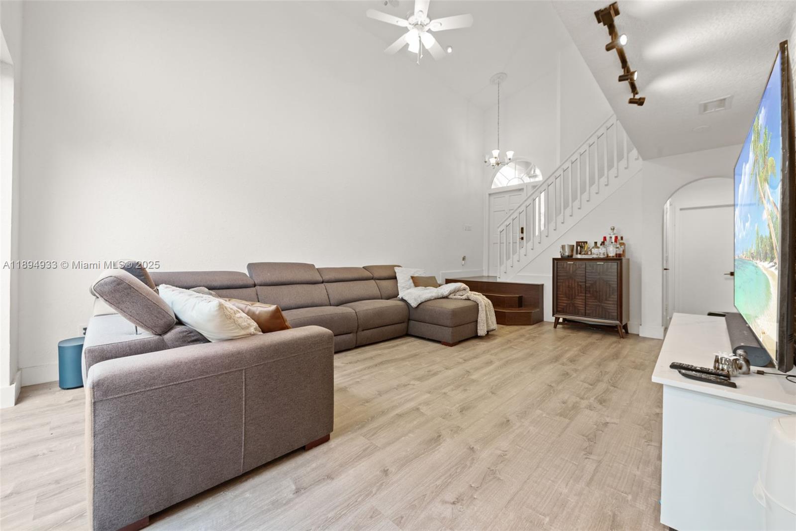 1611 Southwest 158th Avenue Pembroke Pines, FL 33027 - Photo 6 of 25 a living room with furniture and a flat screen tv