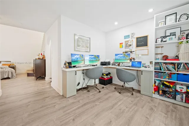 a room with a wooden floor and furniture