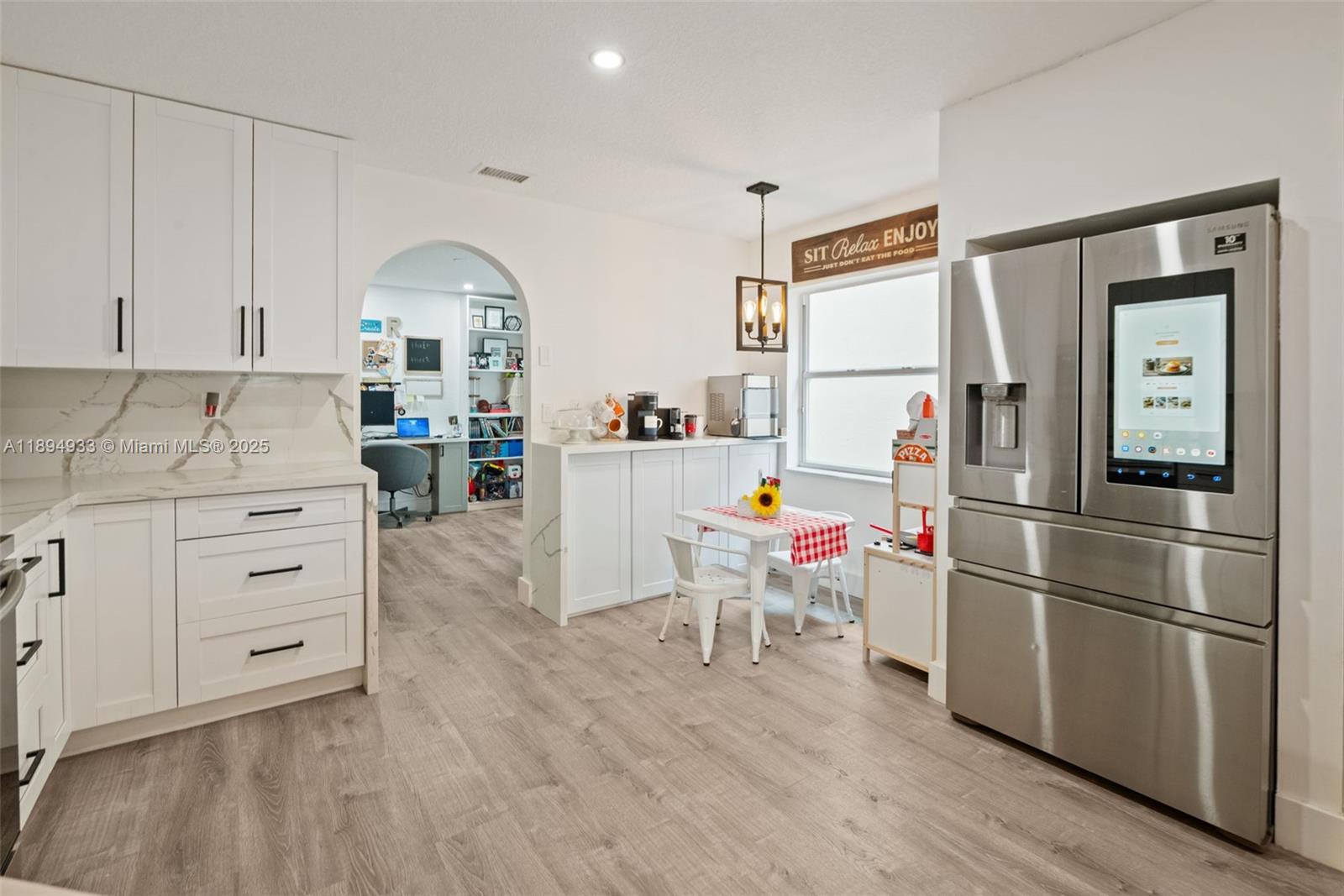 1611 Southwest 158th Avenue Pembroke Pines, FL 33027 - Photo 10 of 25 a room with furniture a flat screen tv and a refrigerator