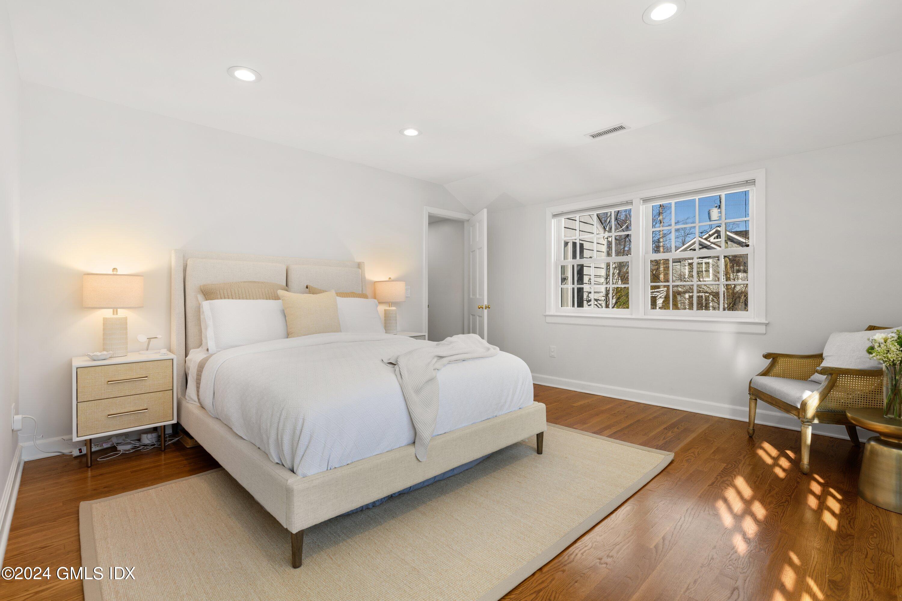 6 Miltiades Avenue Riverside, CT 06878 - Photo 11 of 24 a bedroom with a bed and wooden floor