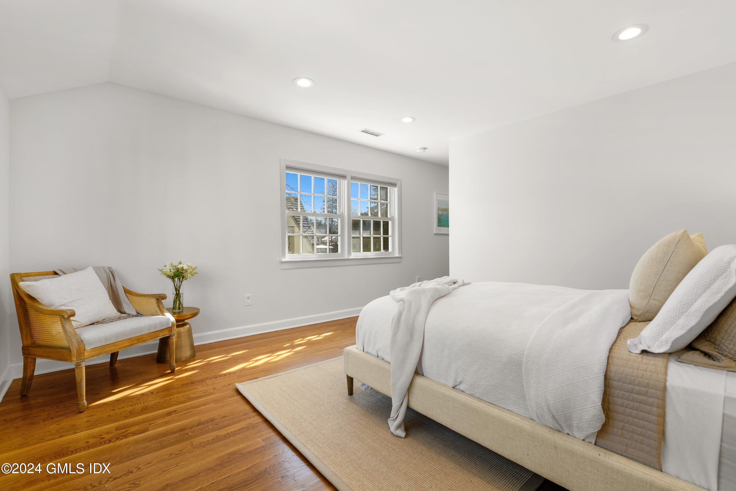 6 Miltiades Avenue Riverside, CT 06878 - Photo 12 of 24 a bedroom with a bed and chair