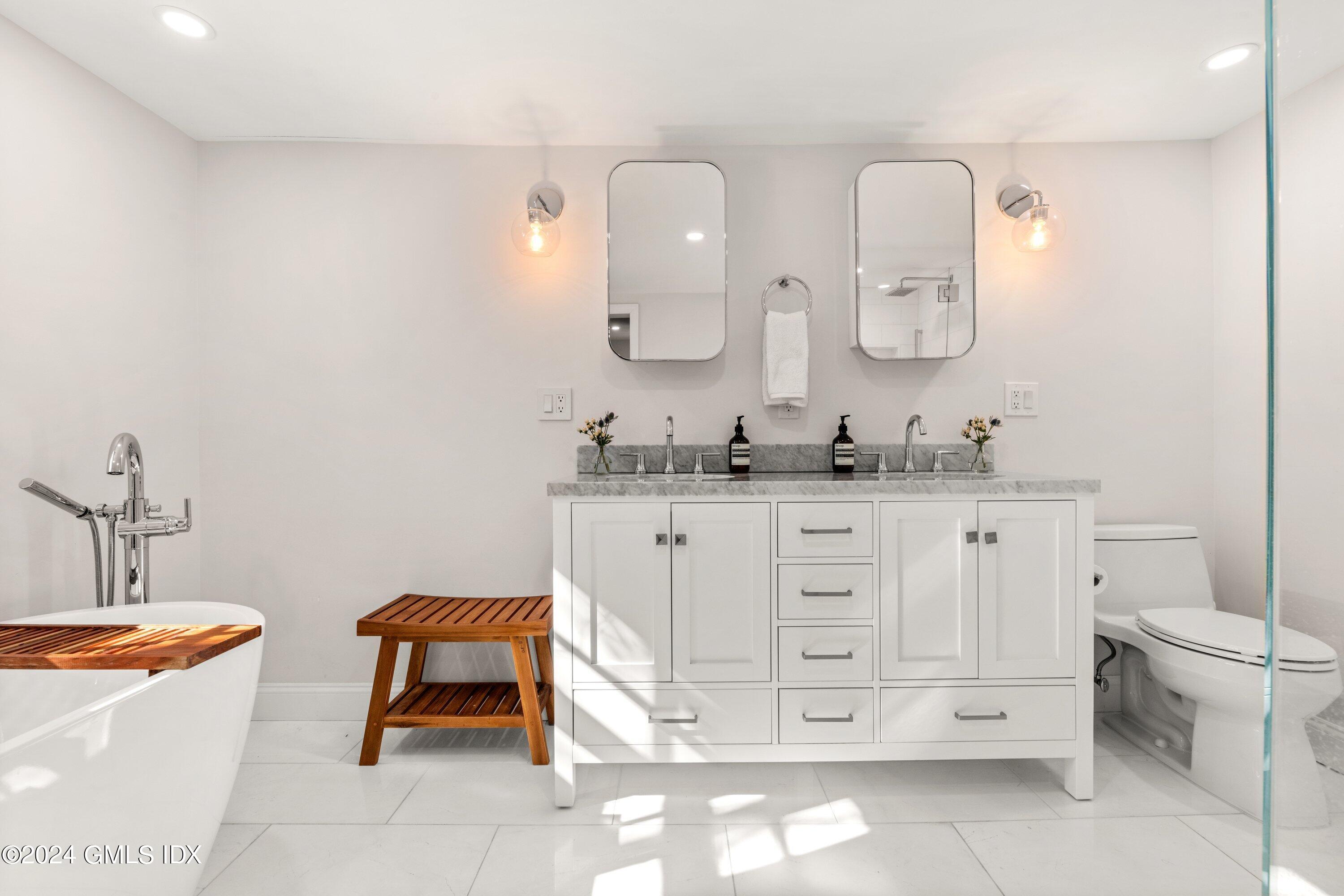 6 Miltiades Avenue Riverside, CT 06878 - Photo 13 of 24 a bathroom with a sink a toilet and a mirror