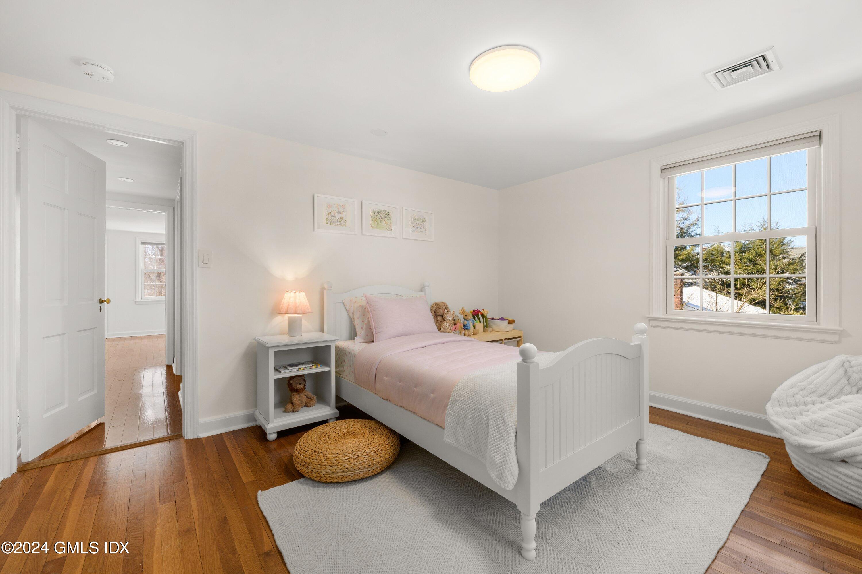 6 Miltiades Avenue Riverside, CT 06878 - Photo 17 of 24 a bedroom with a bed and a window