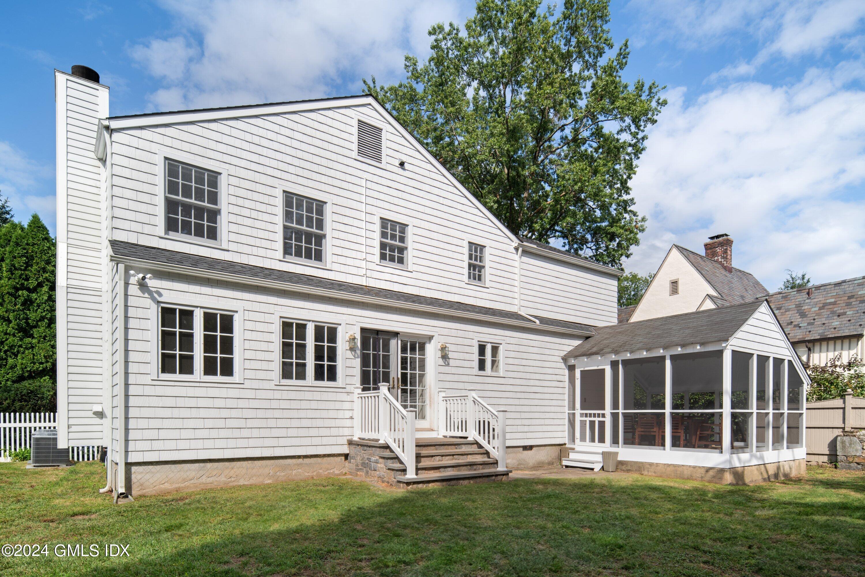 6 Miltiades Avenue Riverside, CT 06878 - Photo 20 of 24 a front view of a house with a garden
