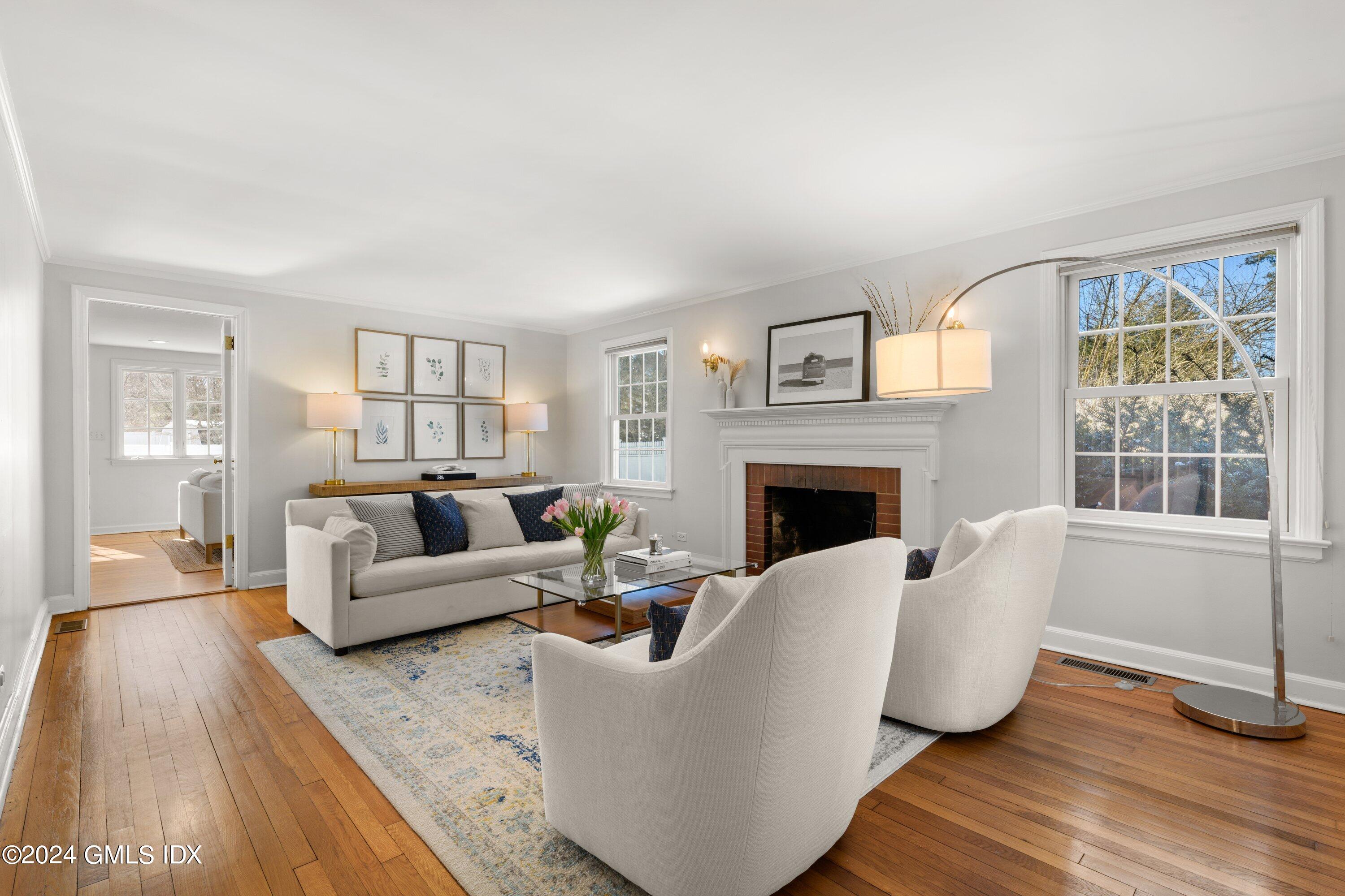 6 Miltiades Avenue Riverside, CT 06878 - Photo 2 of 24 a living room with furniture and a fireplace