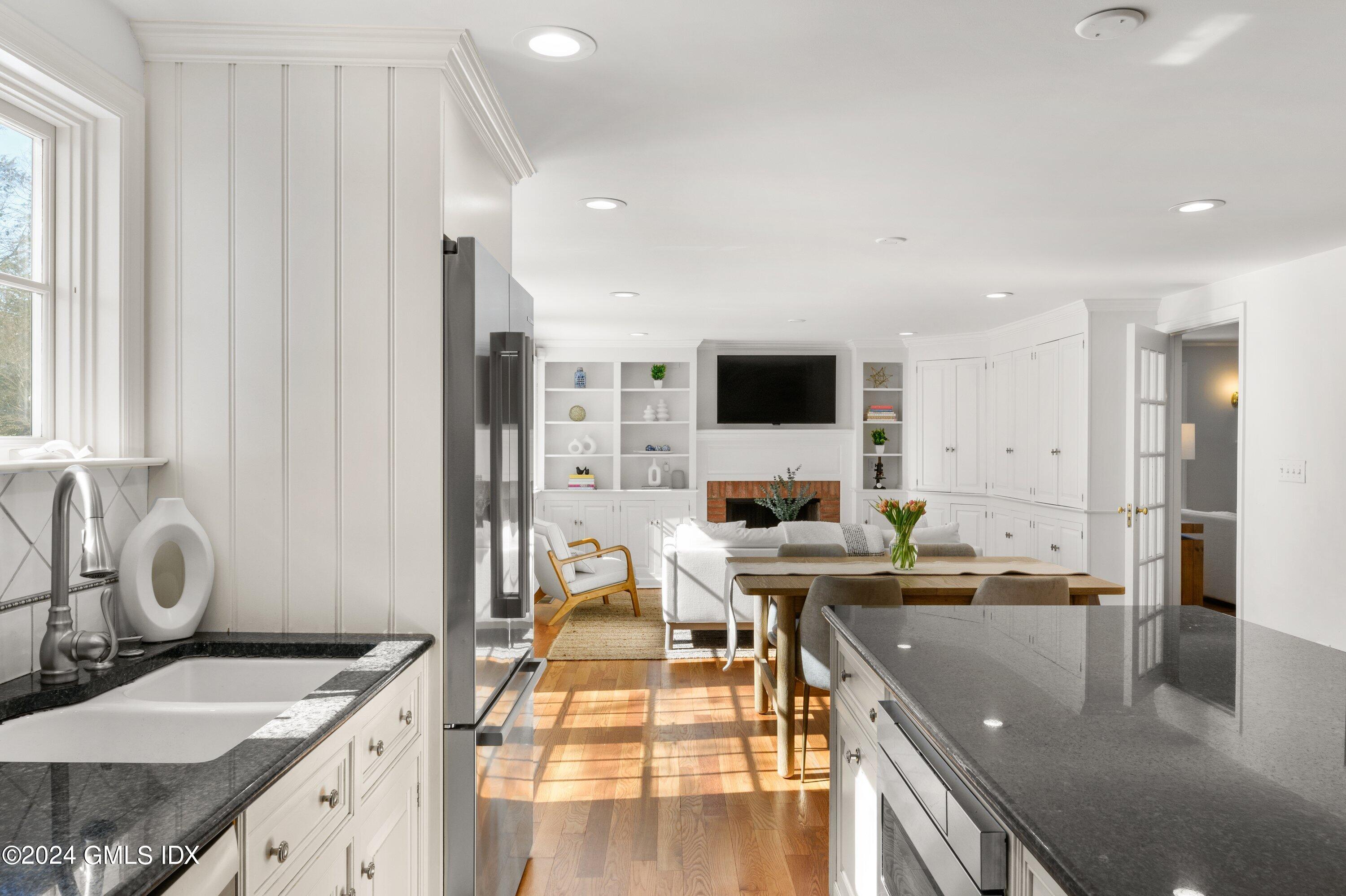 6 Miltiades Avenue Riverside, CT 06878 - Photo 5 of 24 a living room with stainless steel appliances kitchen island granite countertop a sink and cabinets