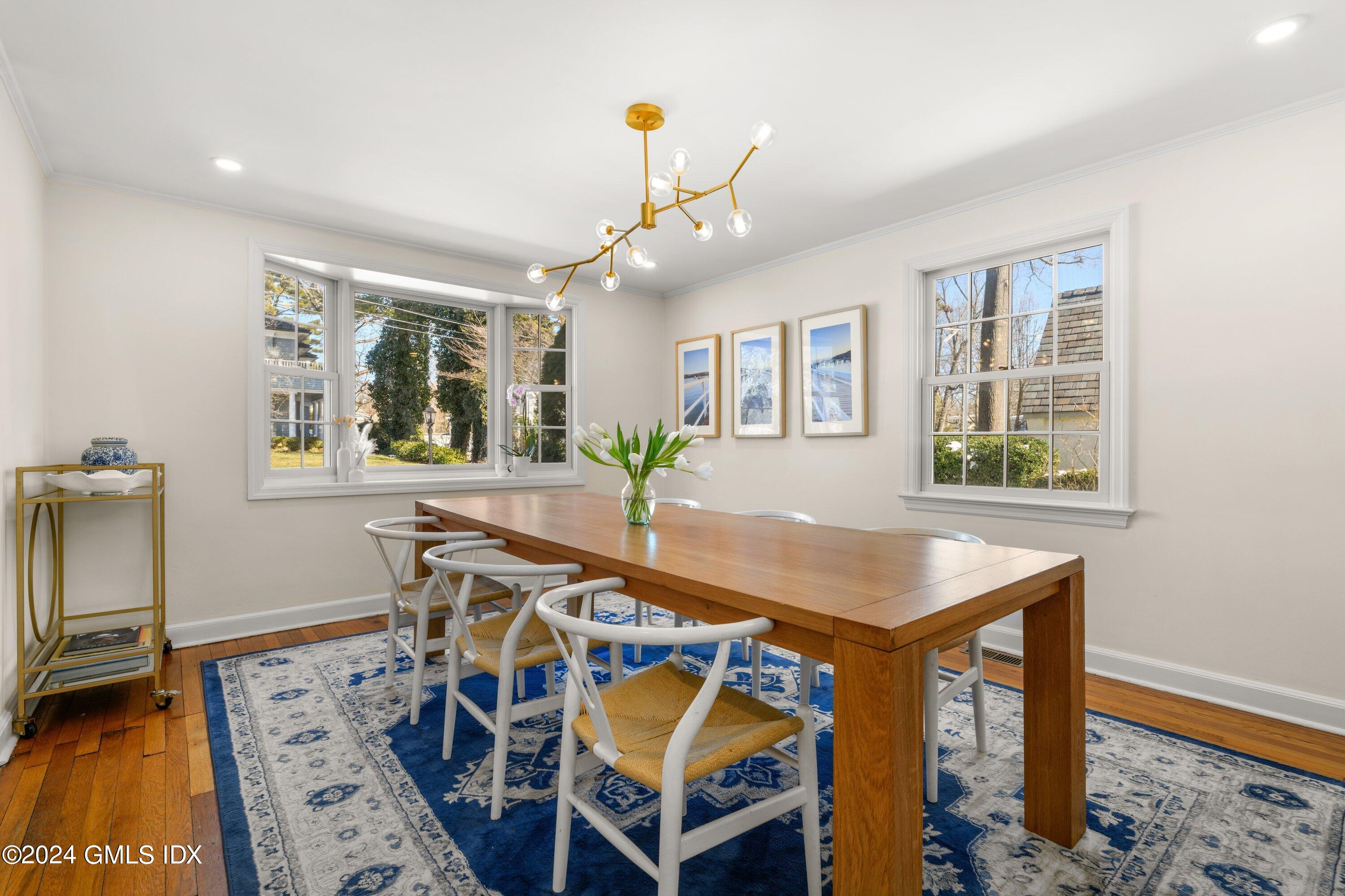 6 Miltiades Avenue Riverside, CT 06878 - Photo 9 of 24 a view of a dining room with furniture and a chandelier