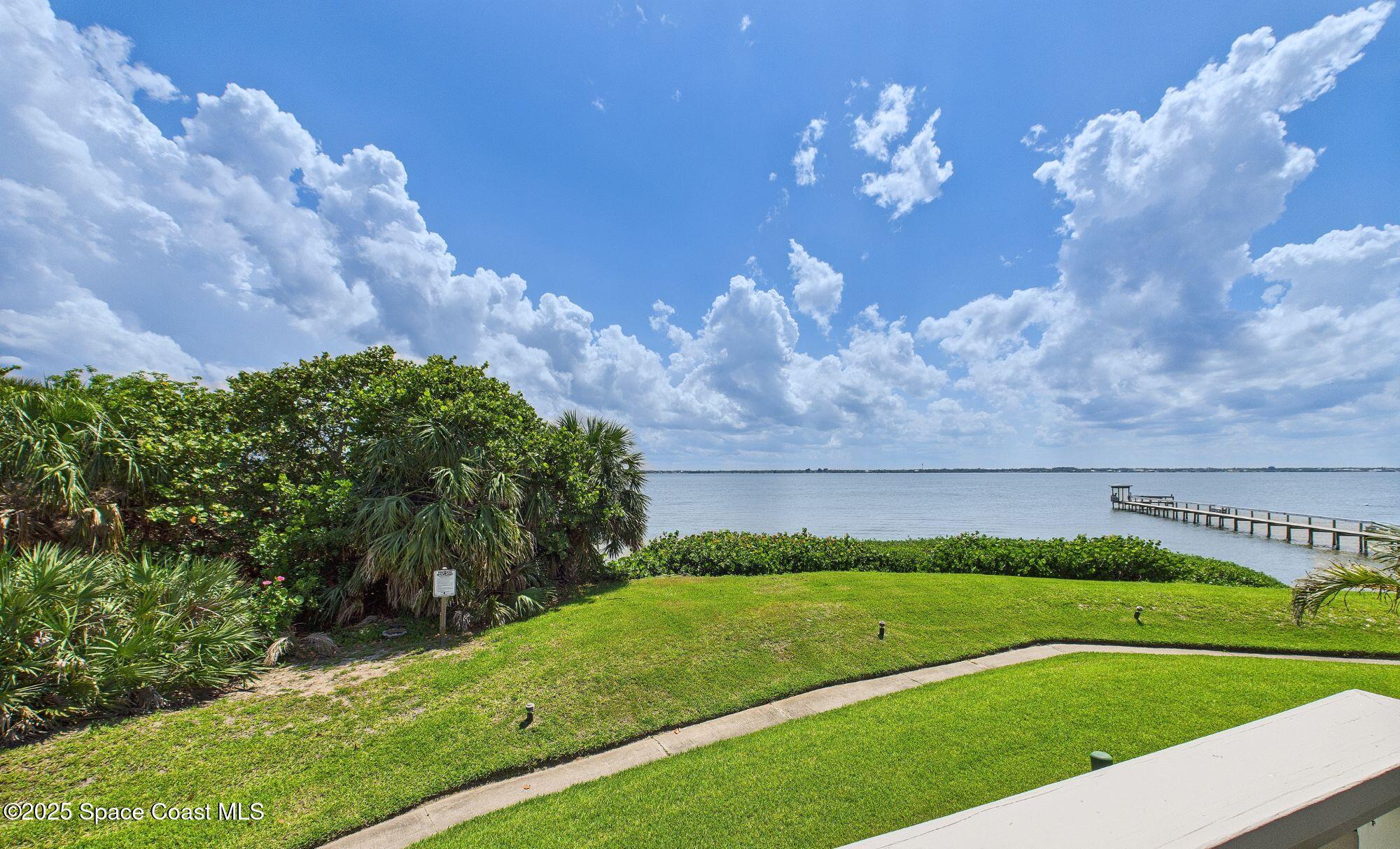 21 Cove Road, Unit 21E Melbourne Beach, FL 32951 - Photo 17 of 30 a view of a golf course with a garden