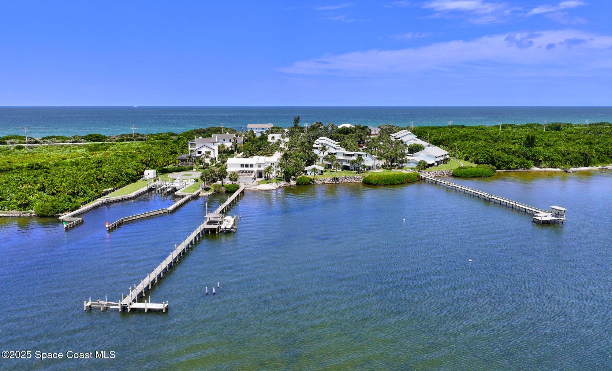 21 Cove Road, Unit 21E Melbourne Beach, FL 32951 - Photo 25 of 30 an aerial view of a golf course with chairs