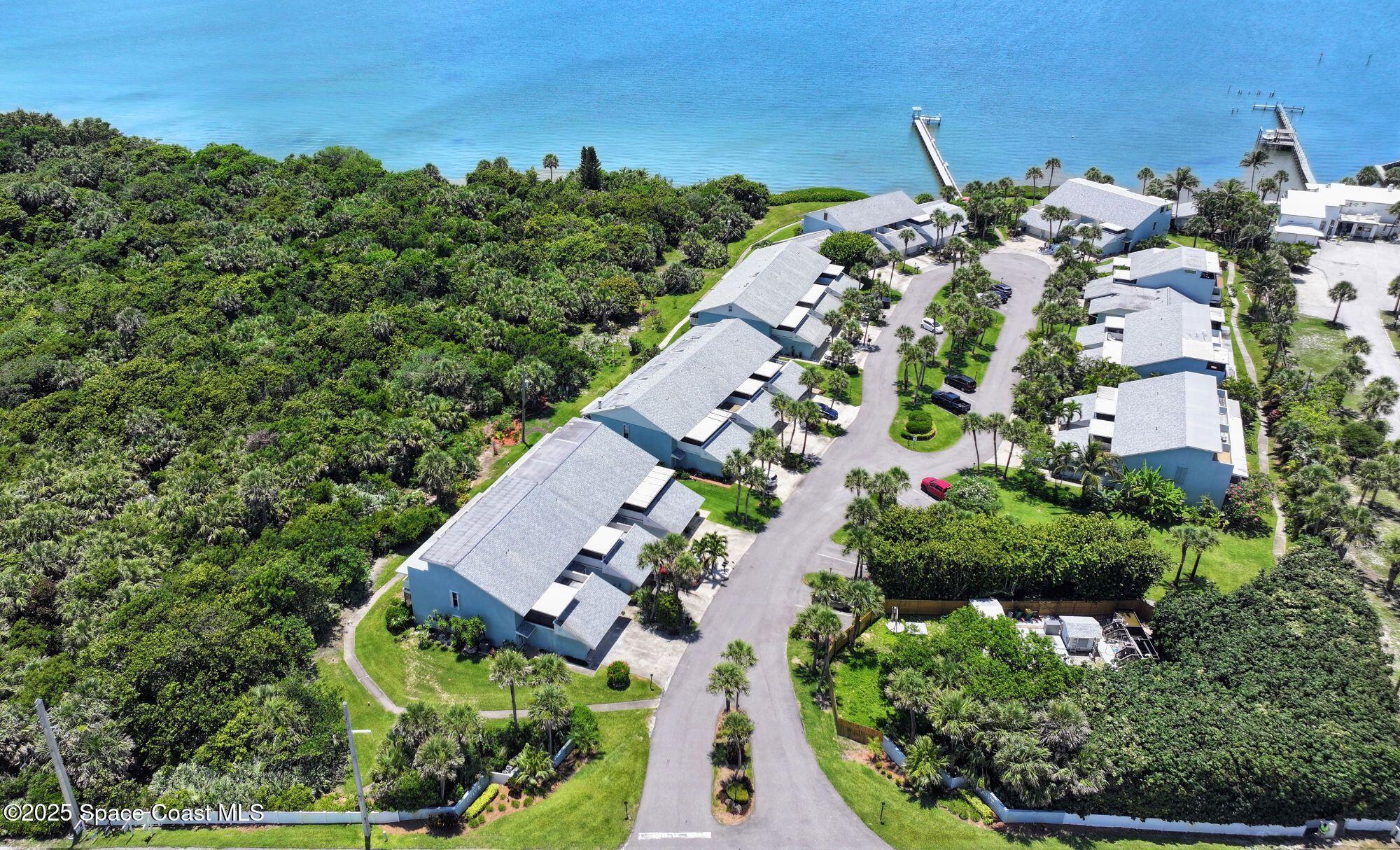 21 Cove Road, Unit 21E Melbourne Beach, FL 32951 - Photo 27 of 30 an aerial view of a house with a yard