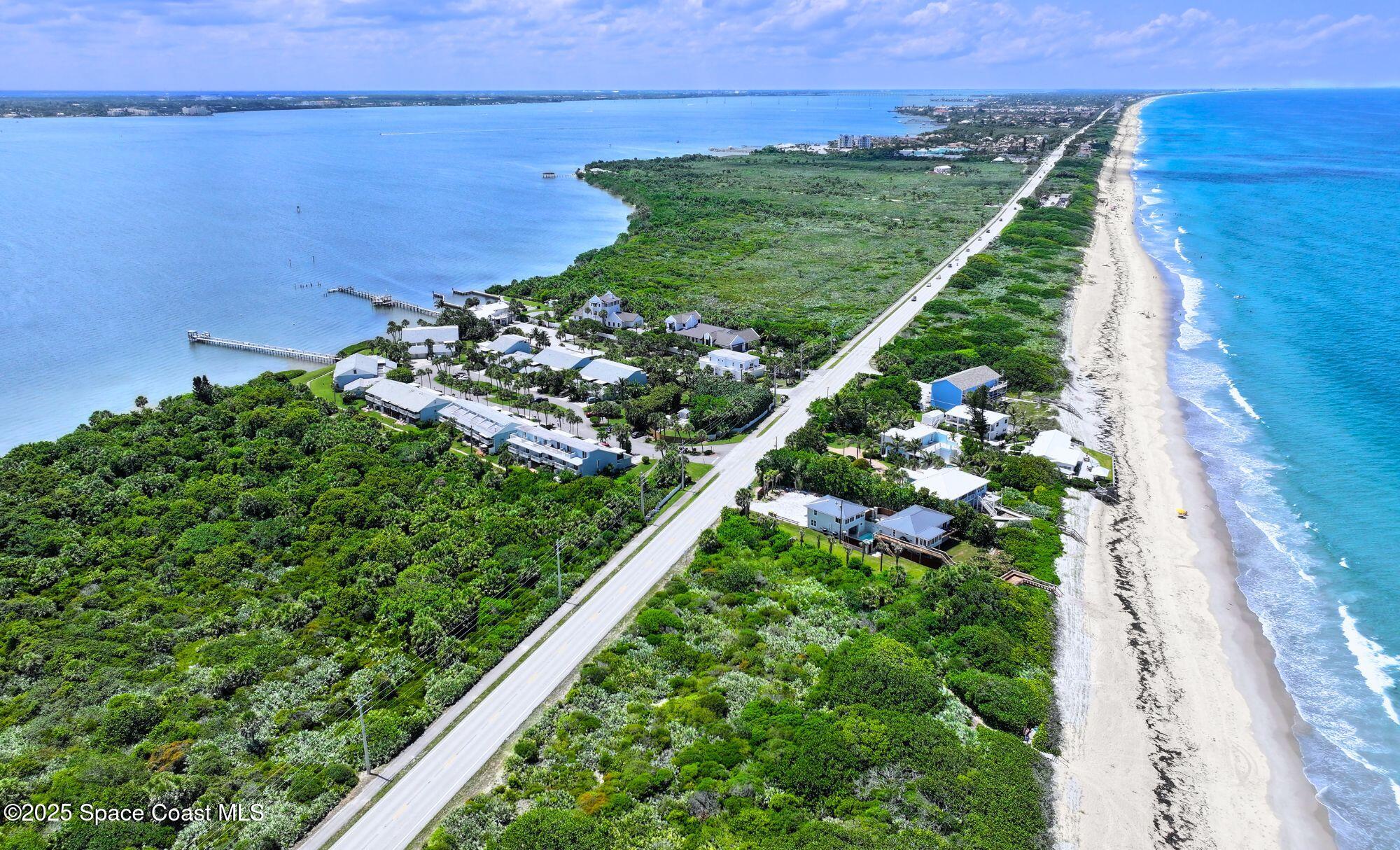 21 Cove Road, Unit 21E Melbourne Beach, FL 32951 - Photo 30 of 30 a view of a garden with an ocean