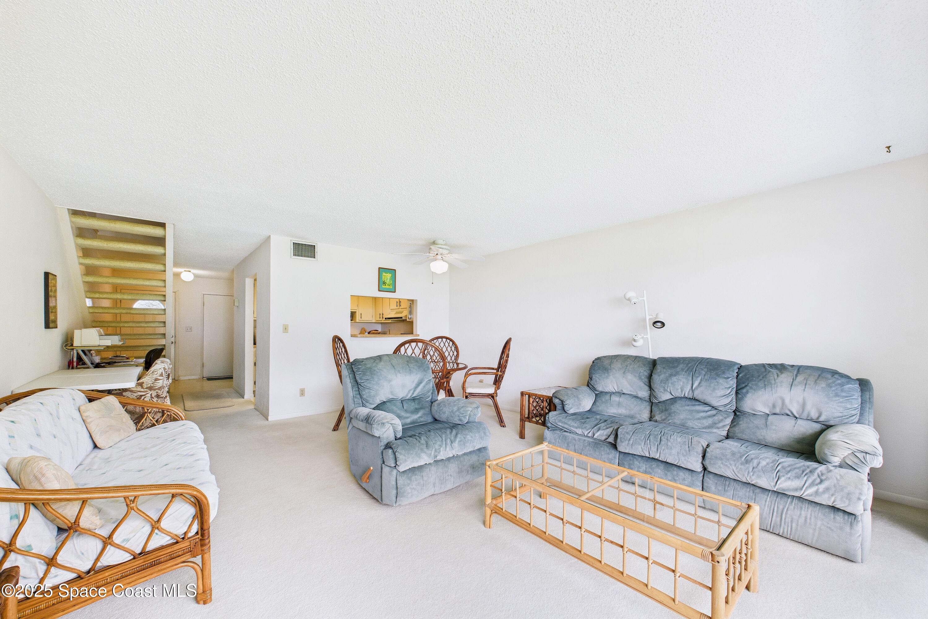 21 Cove Road, Unit 21E Melbourne Beach, FL 32951 - Photo 7 of 30 a living room with furniture