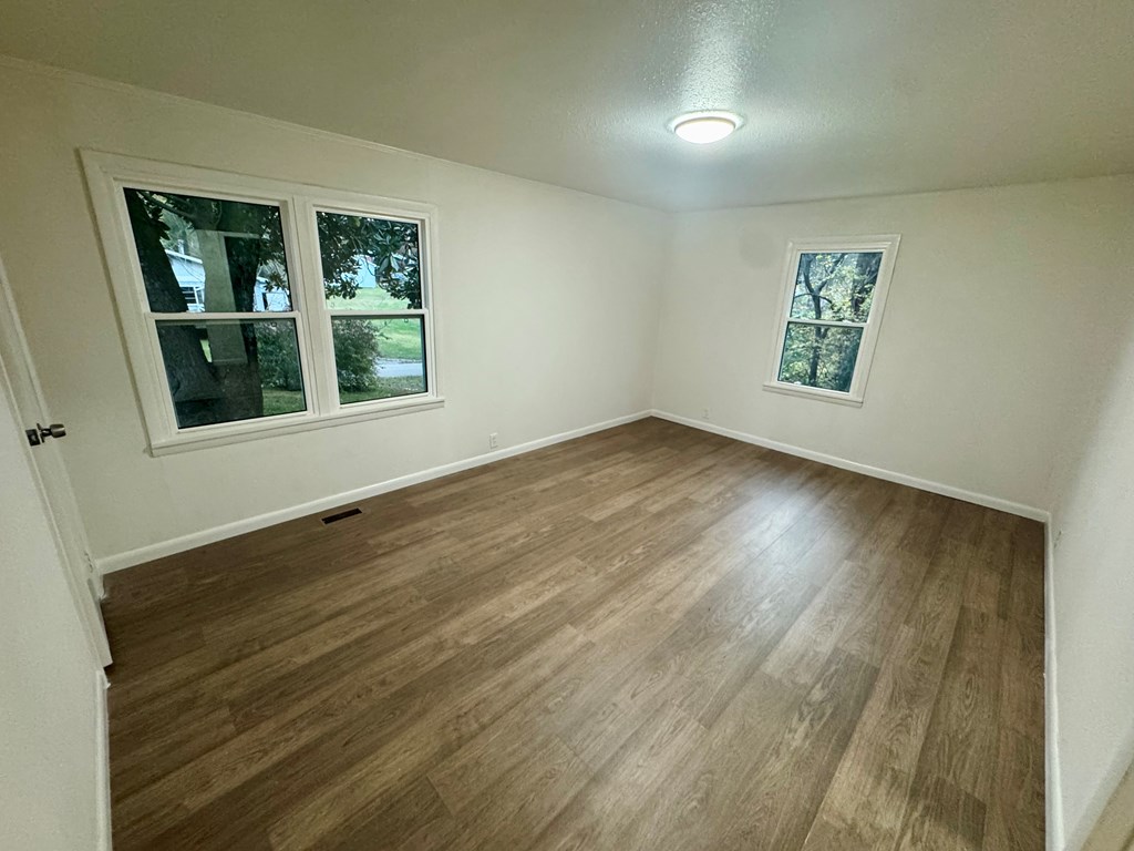 30 McClure Road Epworth, GA 30541 - Photo 13 of 27 a view of an empty room with wooden floor and a window