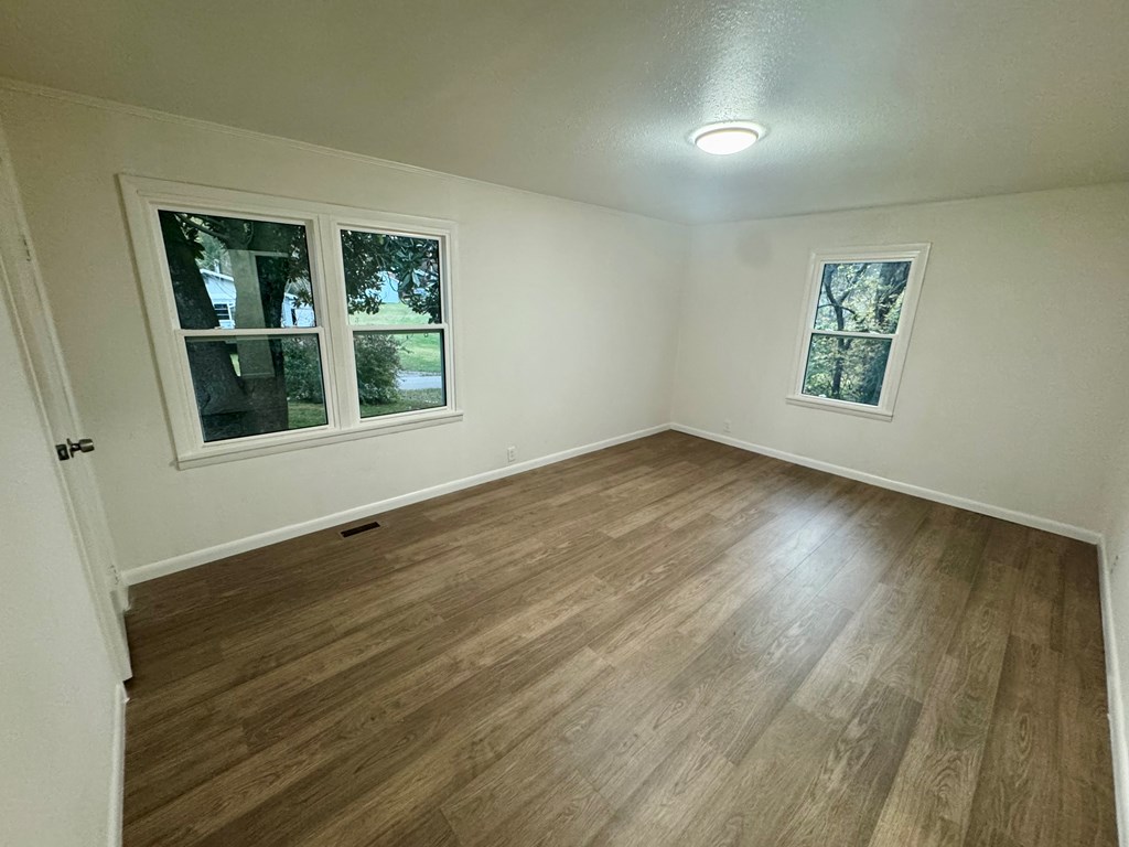 30 McClure Road Epworth, GA 30541 - Photo 14 of 27 a view of an empty room with wooden floor and a window