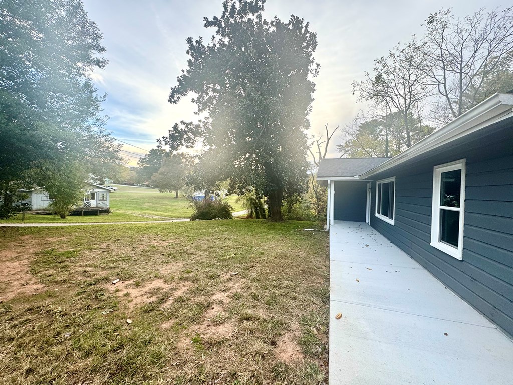 30 McClure Road Epworth, GA 30541 - Photo 19 of 27 a backyard of a house with lots of green space