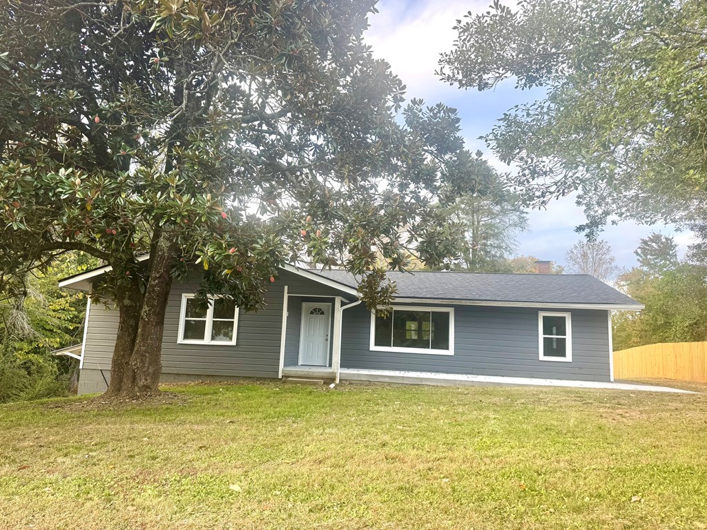 30 McClure Road Epworth, GA 30541 - Photo 21 of 27 a front view of a house with a garden