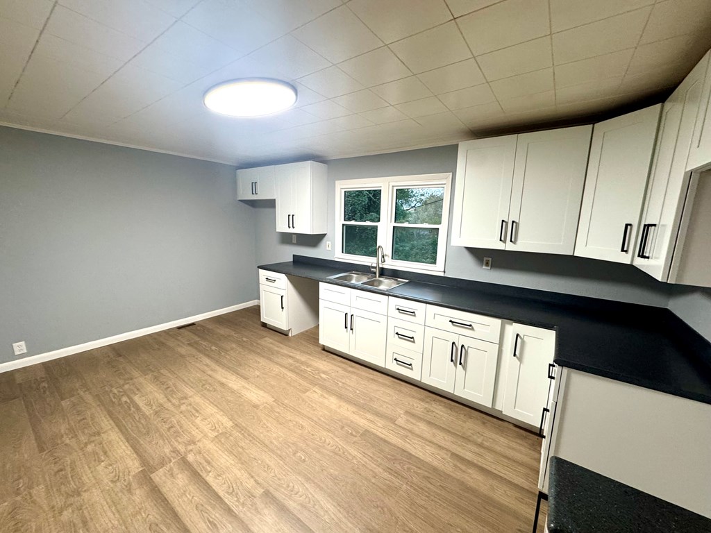 30 McClure Road Epworth, GA 30541 - Photo 25 of 27 a kitchen with stainless steel appliances a sink a stove a microwave and cabinets