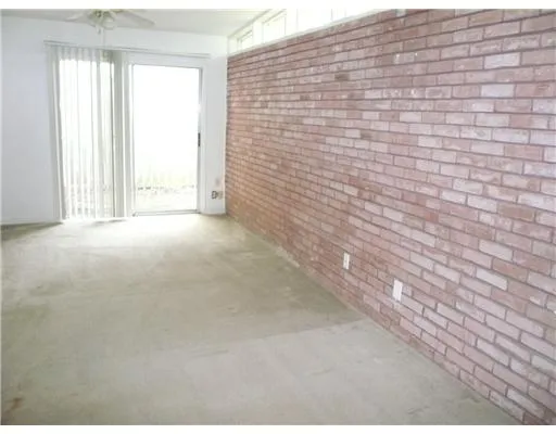 a view of empty room with windows