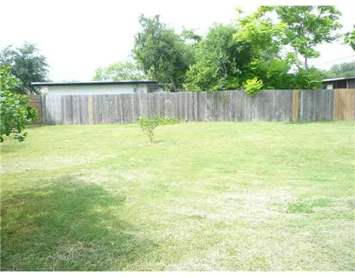 a view of a backyard with green space