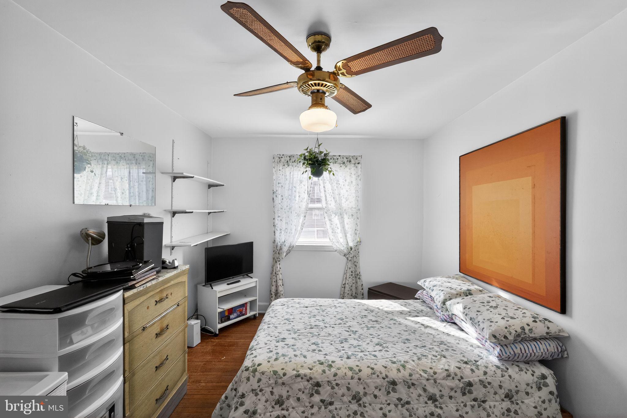 8238 Forrest Avenue Philadelphia, PA 19150 - Photo 14 of 29 a bedroom with a bed and a flat screen tv