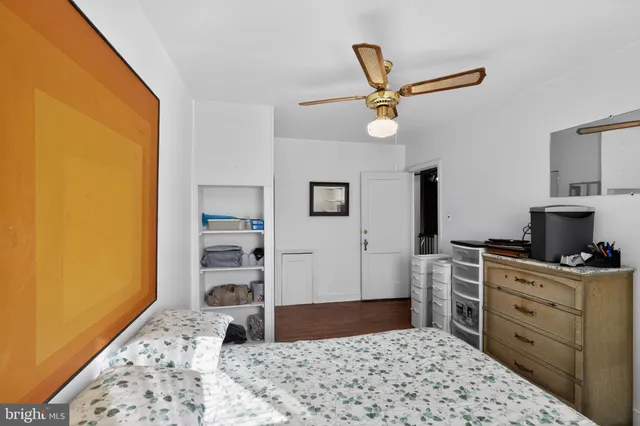 a bedroom with a bed and cabinets