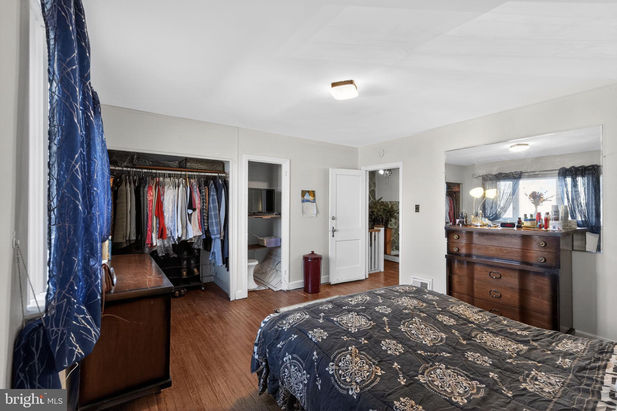 8238 Forrest Avenue Philadelphia, PA 19150 - Photo 17 of 29 a bedroom with a bed and large mirror