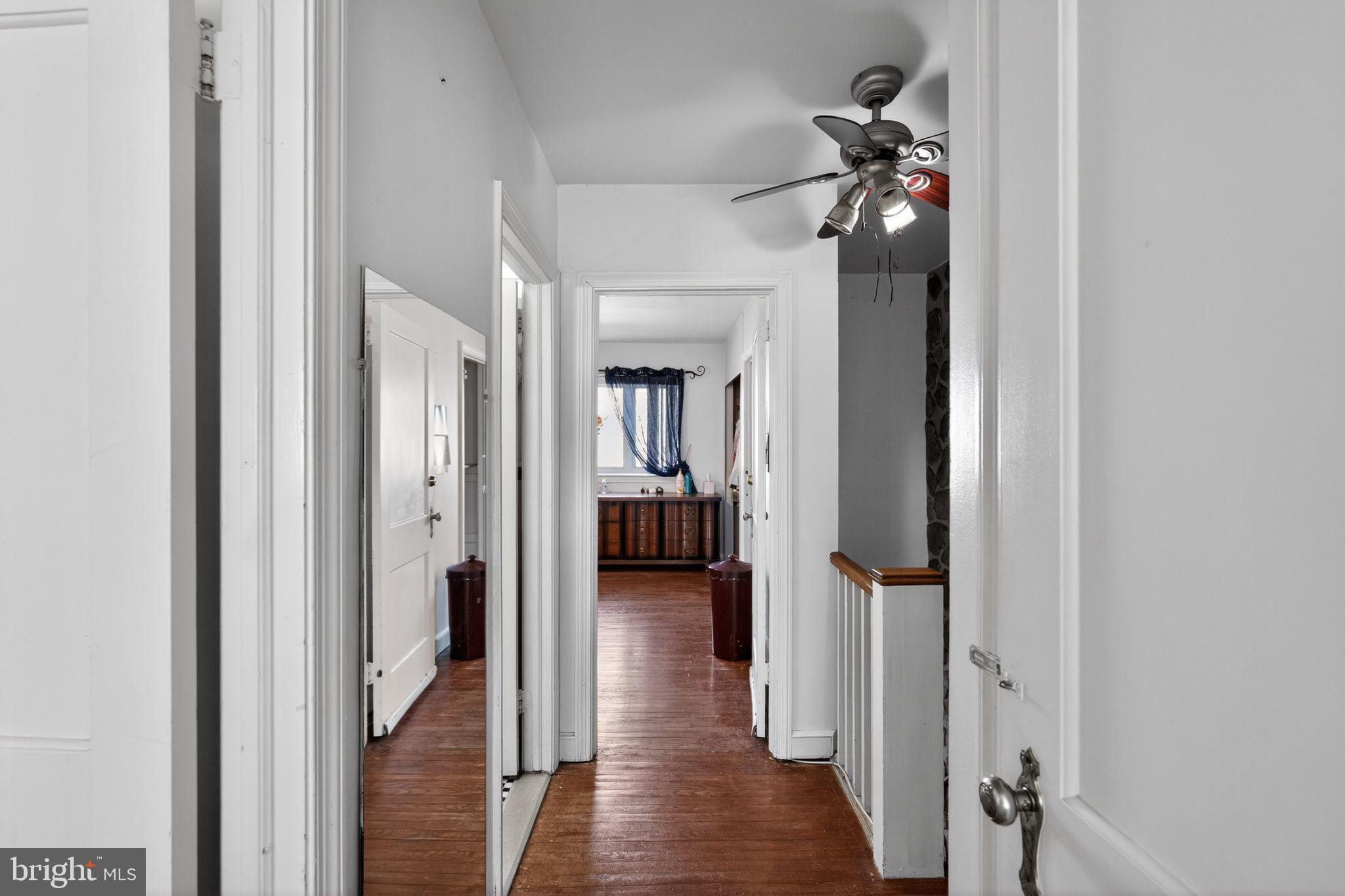8238 Forrest Avenue Philadelphia, PA 19150 - Photo 21 of 29 a view of a hallway with a livingroom and a dinning room with furniture