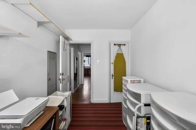 a living room with a bed and furniture