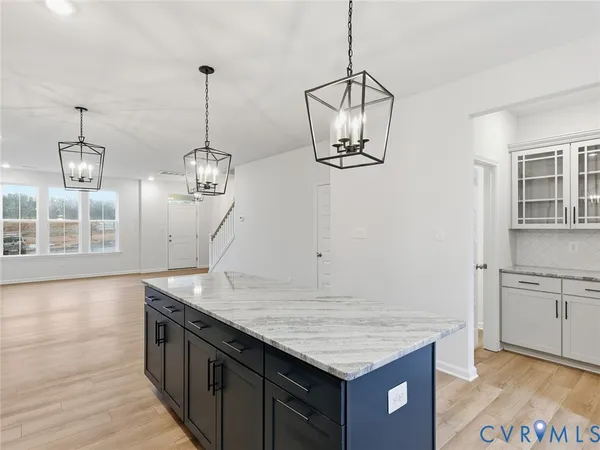 a kitchen with kitchen island a counter top space and appliances