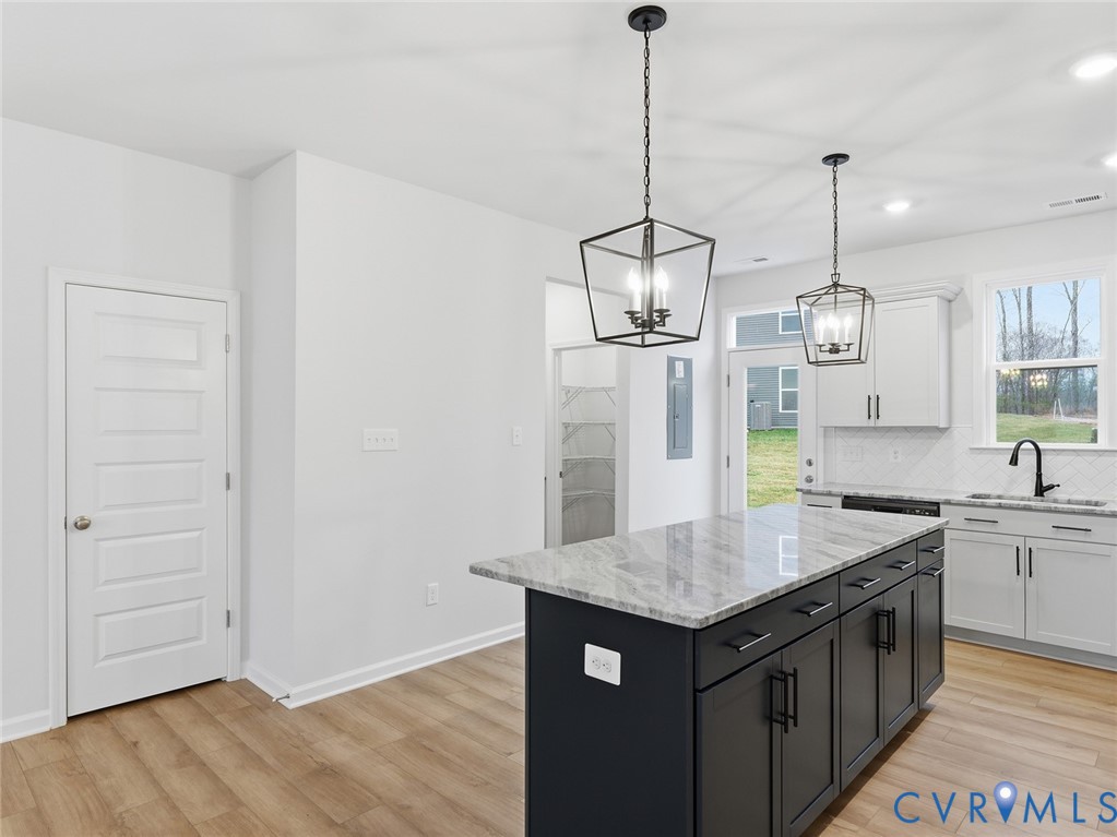 161 Corcoran Way Aylett, VA 23009 - Photo 7 of 21 a kitchen with a counter top space and wooden floor