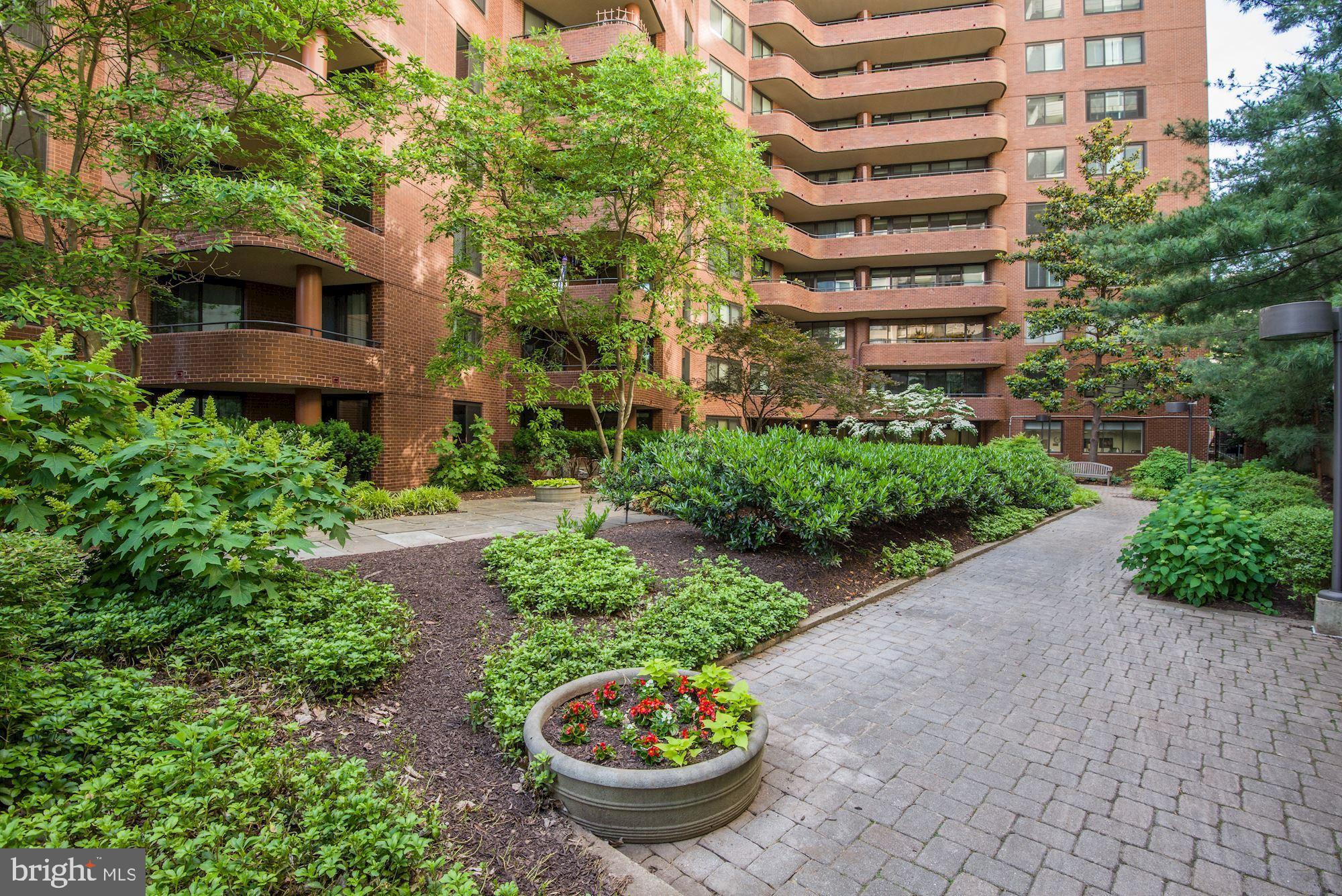 4550 North Park Avenue, Unit 814 Chevy Chase, MD 20815 - Photo 21 of 25 a view of a garden with plants and a fountain