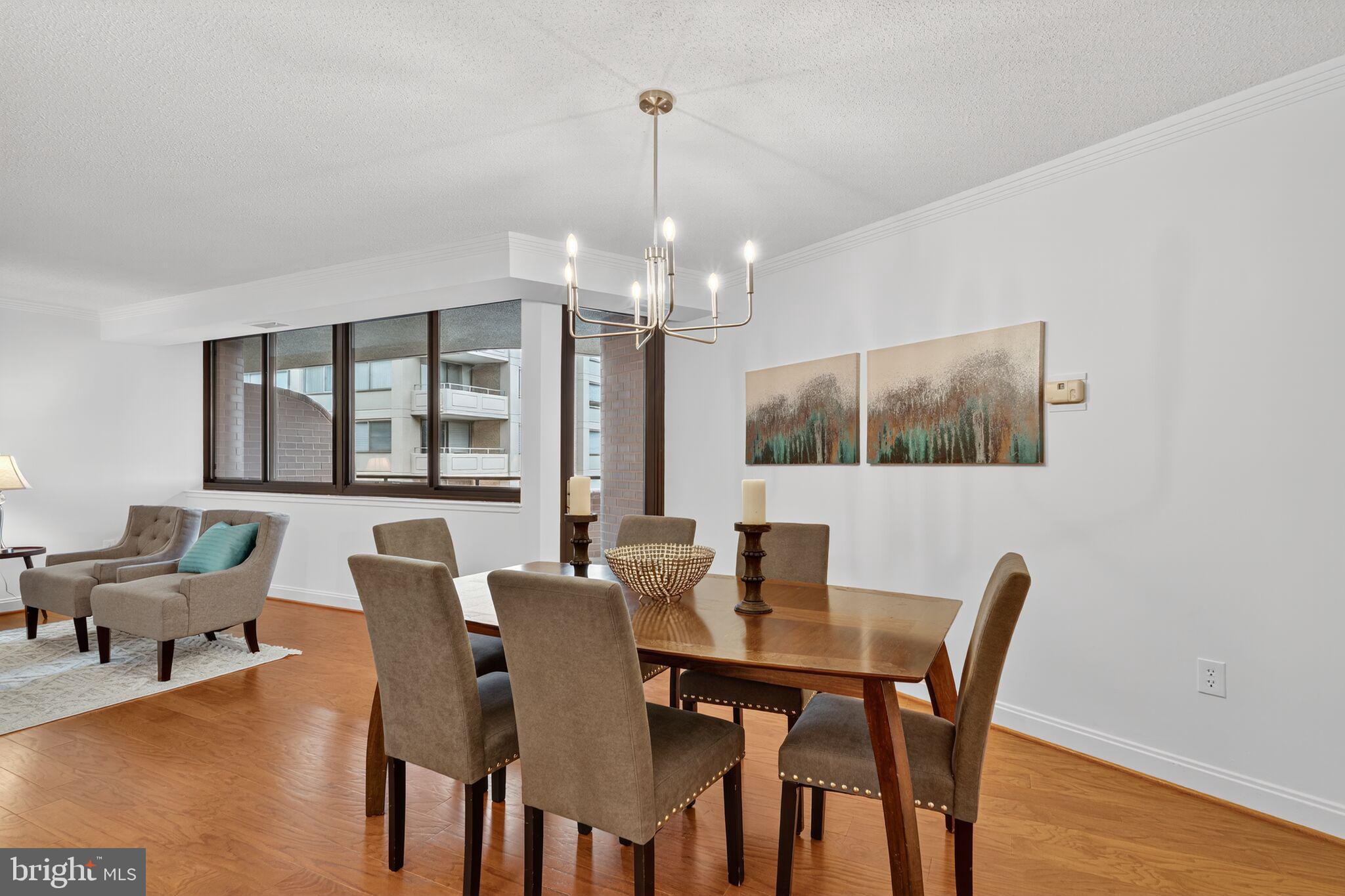 4550 North Park Avenue, Unit 814 Chevy Chase, MD 20815 - Photo 25 of 25 a view of a dining room with furniture window and wooden floor