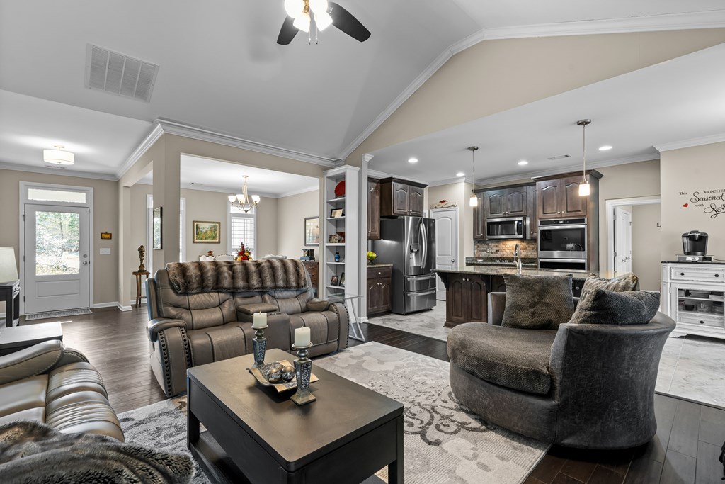 96 Morgan Trail Ellijay, GA 30536 - Photo 24 of 48 a living room with furniture kitchen view and a chandelier