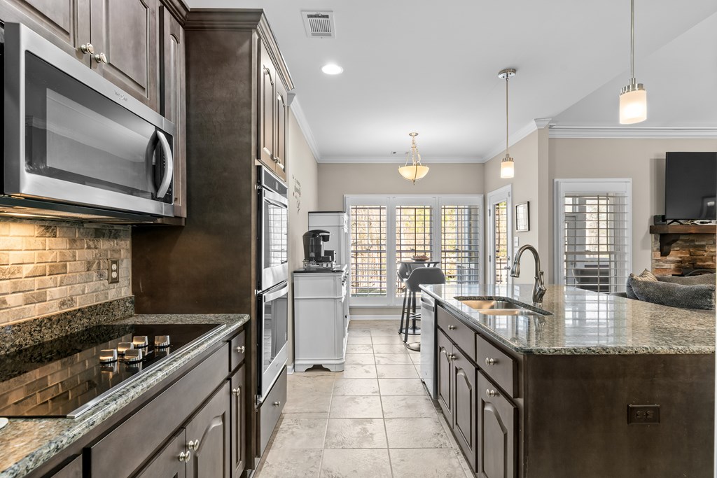 96 Morgan Trail Ellijay, GA 30536 - Photo 29 of 48 a kitchen with stove cabinets and stainless steel appliances