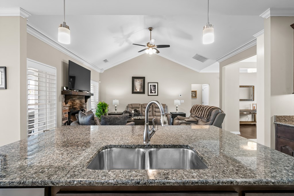 96 Morgan Trail Ellijay, GA 30536 - Photo 30 of 48 a kitchen with granite countertop a sink a counter top space cabinets and stainless steel appliances